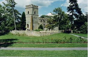 Note the small window above the main windows (the bells were once hung on two levels) and also the windows below the belfry showing the earlier lower height of the tower.